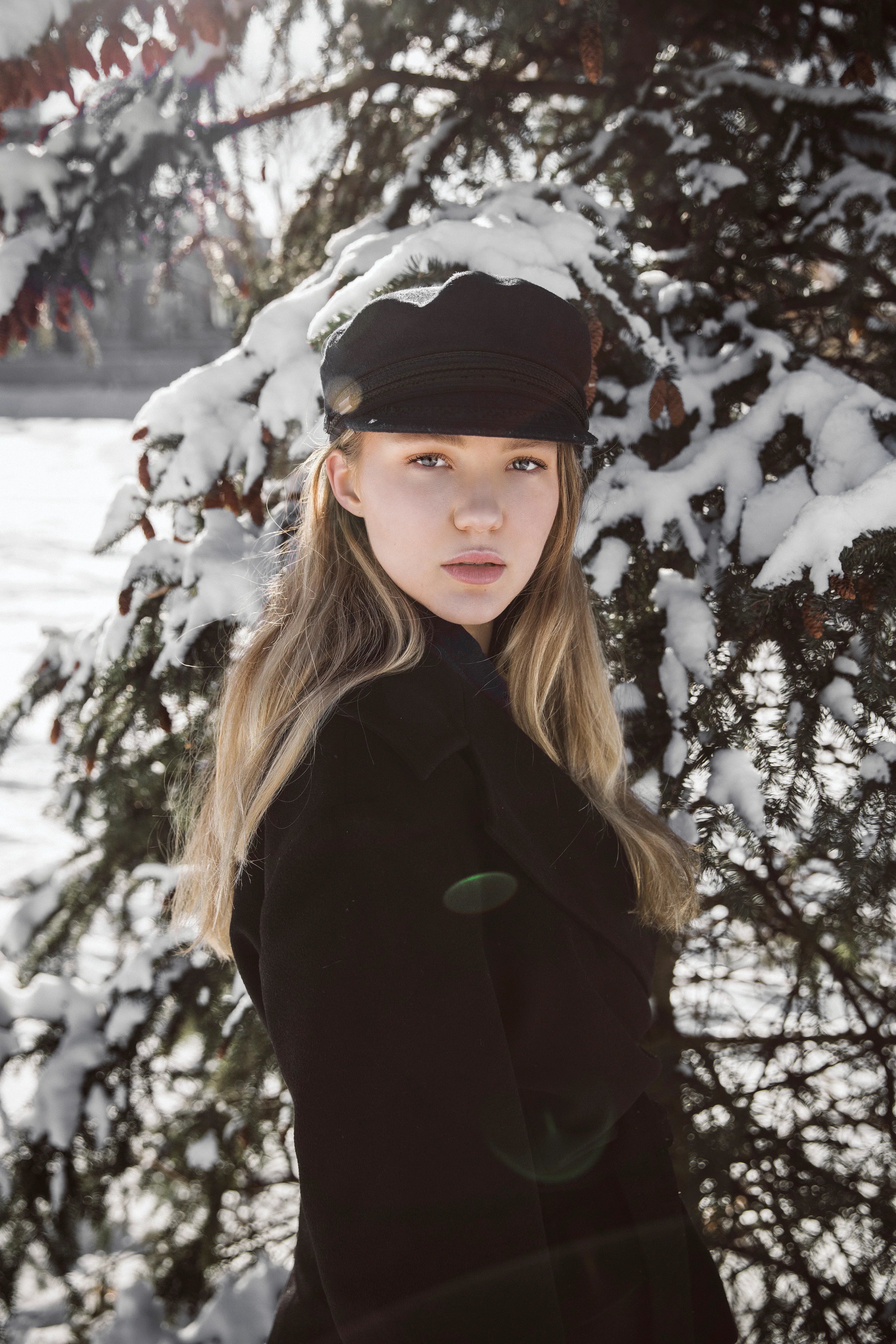 files/blond-woman-with-winter-pine.webp